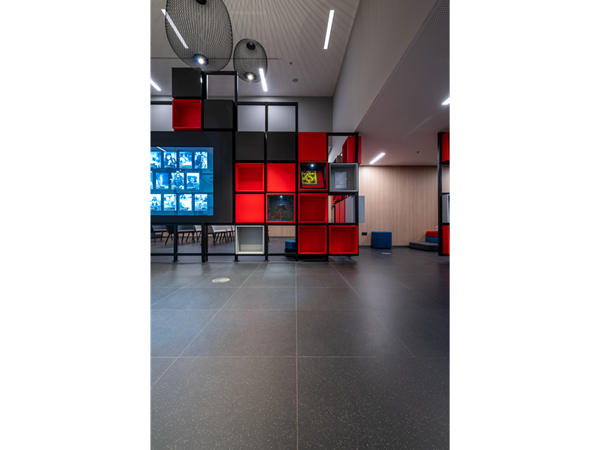 Exhibition room with info-boxes, all in black, red and white